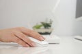 Woman typist using white keyboard and mouse to type and use computer