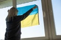 woman with Ukraine flag. Stop war between Russia and Ukraine. Stay with Ukraine. Pray and hope for peace and world. Copy Royalty Free Stock Photo