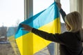 woman with Ukraine flag. Stop war between Russia and Ukraine. Stay with Ukraine. Pray and hope for peace and world. Copy Royalty Free Stock Photo