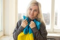 woman with Ukraine flag. Stop war between Russia and Ukraine. Stay with Ukraine. Pray and hope for peace and world. Copy Royalty Free Stock Photo