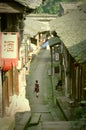 A woman with umbrella in old town