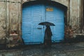 Woman with umbrella on rainy day in town Royalty Free Stock Photo