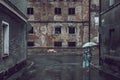 Woman with umbrella on rainy day in town, ruin in the background Royalty Free Stock Photo