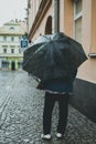 Woman with umbrella on rainy day in town Royalty Free Stock Photo