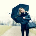 Woman with umbrella in rainy weather