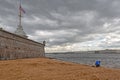 The woman with an umbrella sits near The Neva River. St Petersburg. Russia Royalty Free Stock Photo