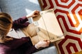 Woman unboxing unpacking Amazon.com box