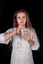 Woman with unchained handcuffs and dollar notes