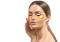 Woman with under eye collagen gold pads, beauty model girl face with healthy fresh skin. Skin care concept, anti-aging mask Royalty Free Stock Photo