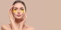 Woman with under eye collagen gold pads, beauty model girl face with healthy fresh skin. Skin care concept, anti-aging mask Royalty Free Stock Photo