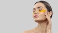 Woman with under eye collagen gold pads, patches, beauty model girl face with healthy fresh skin. Skin care concept Royalty Free Stock Photo