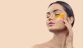 Woman with under eye collagen gold pads, patches, beauty model girl face with healthy skin. Skin care concept, anti-aging Royalty Free Stock Photo