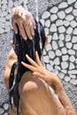 Woman under outdoor water shower