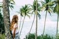 Woman under palm tree at beach Mirisa Sri Lanka close up Royalty Free Stock Photo