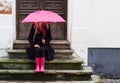 Woman under pink umbrella Royalty Free Stock Photo