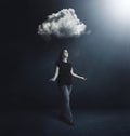 Woman under rain cloud