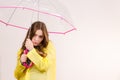 Woman under umbrella looking sad unhappy