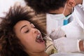 Woman Undergoing Dental Treatment