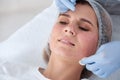 Woman undergoing face biorevitalization procedure Royalty Free Stock Photo