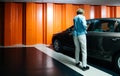 Woman in underground parking with Skoda Octavia car