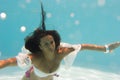 Woman undewater in the swimming pool Royalty Free Stock Photo