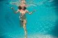 Woman undewater in the swimming pool Royalty Free Stock Photo