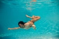 Woman undewater in the swimming pool Royalty Free Stock Photo