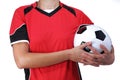 Woman in uniform holding a soccer ball