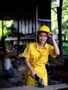 A woman in a uniform working in a technician is preparing to use the tools