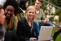 Woman, university student with laptop and outdoor on campus, smile and research to study for exams. Diverse group