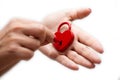 Woman unlocking heart shaped lock Royalty Free Stock Photo