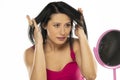 Woman unravel her hair with the fingers