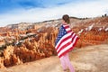 Woman with USA flag, Bryce Canyon National Park Royalty Free Stock Photo