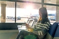 Woman use of cellphone at airport Royalty Free Stock Photo