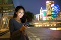 Woman use cellphone at night Royalty Free Stock Photo