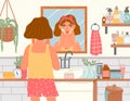 Woman use cream in bathroom. Female facial skincare with organic eco cosmetic. Girl looks in mirror, daily beauty care