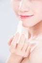 Woman use lip balm Royalty Free Stock Photo