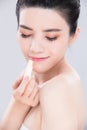 Woman use lip balm Royalty Free Stock Photo