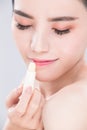 Woman use lip balm Royalty Free Stock Photo