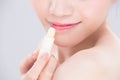 Woman use lip balm Royalty Free Stock Photo