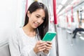 Woman use of mobile phone on train Royalty Free Stock Photo