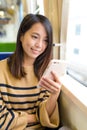 Woman use of mobile phone on train Royalty Free Stock Photo