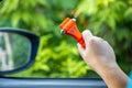 Woman use Safety Hammer and Seatbelt Cutter in Cars, break glass When emergency. In case of emergency on car safety red hammers to Royalty Free Stock Photo