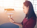 Woman use smartphone in airport. Royalty Free Stock Photo