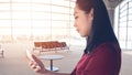 Woman use smartphone in airport. Royalty Free Stock Photo