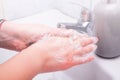 Woman use soap and washing hands under the water tap. Hygiene concept hand detail Royalty Free Stock Photo