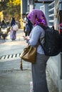 Woman uses her mobile phone on the street