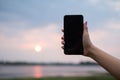 Woman uses she Mobile Phone outdoor, close up