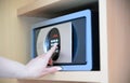 woman uses a safe in hotel