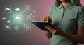 Woman uses tablet with data security and cloud computing technology icons Royalty Free Stock Photo